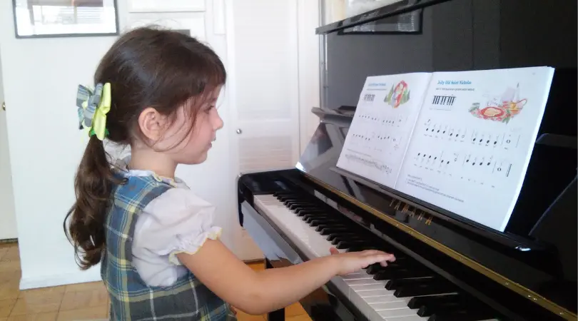 Girl learning piano